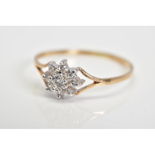 34 - A 9CT GOLD CUBIC ZIRCONIA CLUSTER RING, designed as a cluster of circular colourless cubic zirconias... 