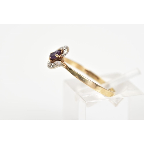 35 - A 9CT GOLD AMETHYST AND DIAMOND DRESS RING, the central oval amethyst set on a diagonal within a cro... 