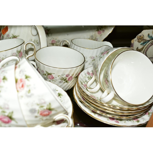 374 - MINTON 'SPRING BOUQUET' TEA AND DINNER WARES, comprising teapot, oval cake plate, twelve tea cups, e... 