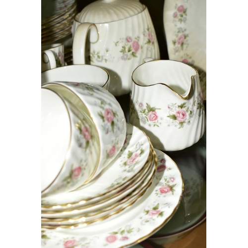 374 - MINTON 'SPRING BOUQUET' TEA AND DINNER WARES, comprising teapot, oval cake plate, twelve tea cups, e... 