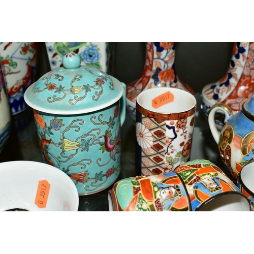 378 - A GROUP OF JAPANESE AND CHINESE CERAMICS to include a Japanese tea service, a pair of narrow necked ... 