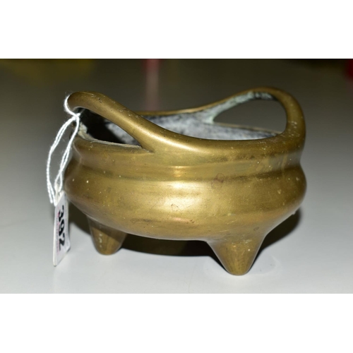 392 - A CHINESE POLISHED BRONZE TRIPOD CENSER, 18th / 19th Century, looped handles, cast mark to underside... 