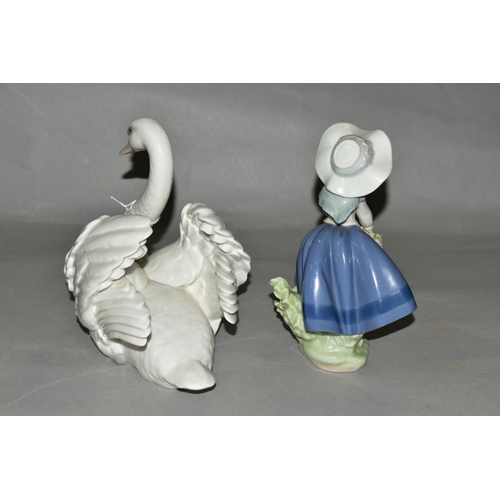 394 - TWO LLADRO FIGURES, a swan with wings spread, No5231, designed by Francisco Catala, height 17.5cm, a... 