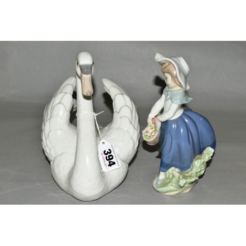 394 - TWO LLADRO FIGURES, a swan with wings spread, No5231, designed by Francisco Catala, height 17.5cm, a... 