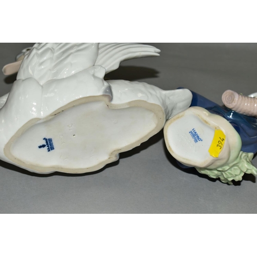 394 - TWO LLADRO FIGURES, a swan with wings spread, No5231, designed by Francisco Catala, height 17.5cm, a... 