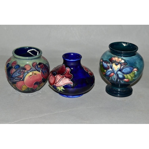 397 - THREE SMALL MOORCROFT POTTERY VASES, 'Finches and Fruit' pattern, height 7.5cm, 'Anemone' pattern on... 