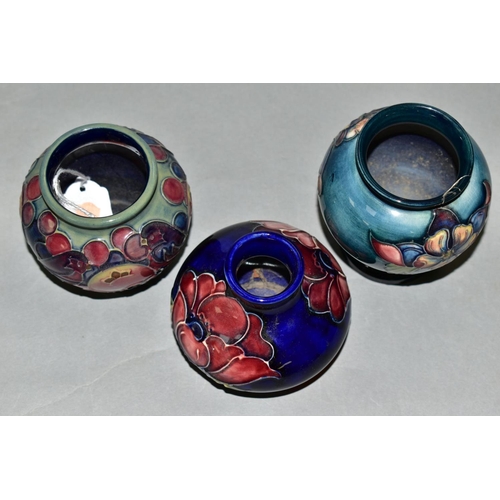 397 - THREE SMALL MOORCROFT POTTERY VASES, 'Finches and Fruit' pattern, height 7.5cm, 'Anemone' pattern on... 