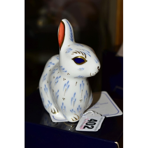 402 - A BOXED ROYAL CROWN DERBY PAPERWEIGHT, 'Snowy Rabbit' anniversary edition for 2002, launched to cele... 