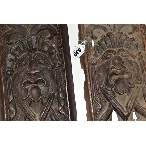 439 - TWO CARVED TREEN PANELS, of rectangular form, 17th Century and later, carved with identical mask and... 