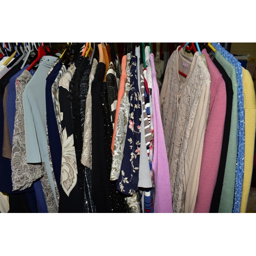 455 - A LARGE COLLECTION OF LADIES WEAR, to include knitwear, skirts, trousers, etc, in sizes 14, 16 and 1... 