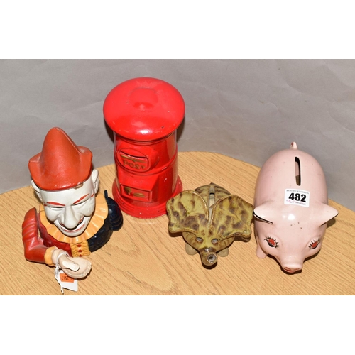 482 - FOUR MONEY BOXES, comprising a reproduction cast iron clown money box and three ceramic money boxes ... 