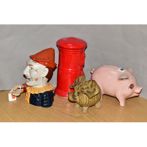 482 - FOUR MONEY BOXES, comprising a reproduction cast iron clown money box and three ceramic money boxes ... 