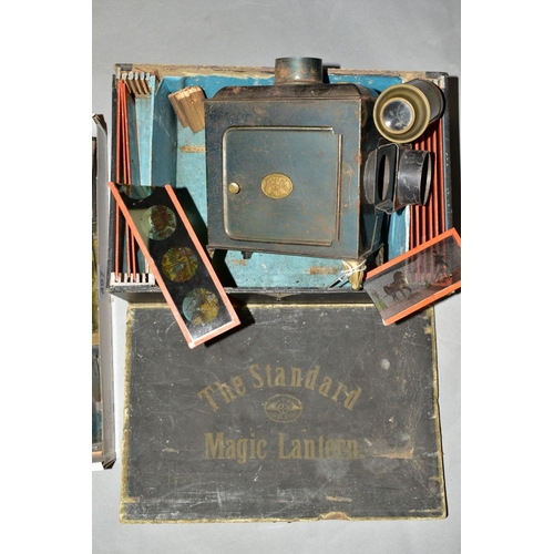 497 - A BOXED ERNST PLANCK STANDARD MAGIC LANTERN, with a quantity of coloured slides, lantern in fair con... 