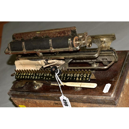 498 - A CASED MERRITT TYPEWRITER, Amercian circa late 19th century, mounted on a wooden base stamped '1234... 