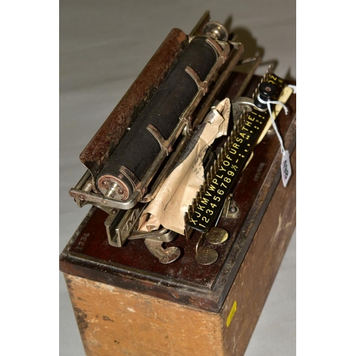 498 - A CASED MERRITT TYPEWRITER, Amercian circa late 19th century, mounted on a wooden base stamped '1234... 