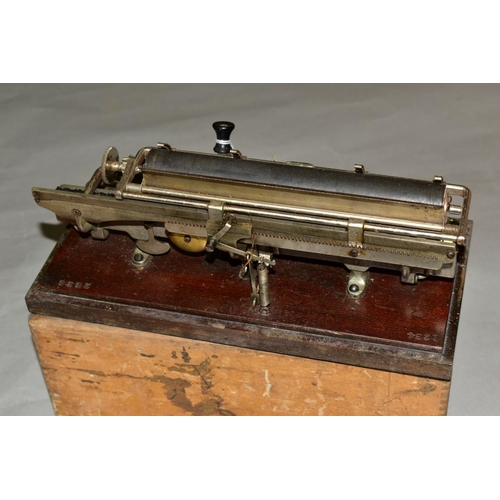 498 - A CASED MERRITT TYPEWRITER, Amercian circa late 19th century, mounted on a wooden base stamped '1234... 