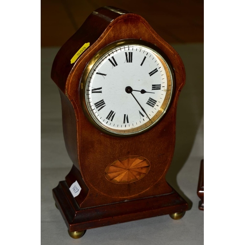 500 - TWO EDWARDIAN MAHOGANY MANTEL CLOCKS, both with wavy domes and white enamel dials, one with inlaid c... 