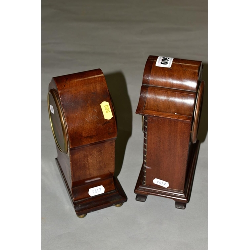 500 - TWO EDWARDIAN MAHOGANY MANTEL CLOCKS, both with wavy domes and white enamel dials, one with inlaid c... 