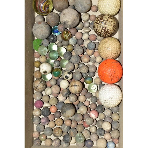 512 - A QUANTITY OF ASSORTED MARBLES, mainly stone with some glass examples and a number of golf balls