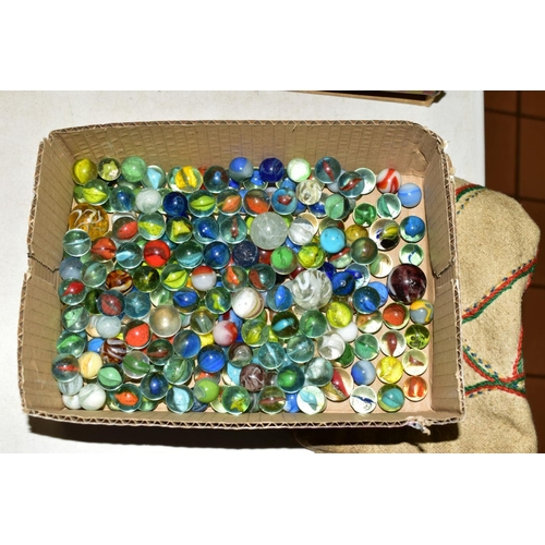 515 - A QUANTITY OF ASSORTED MARBLES, assorted designs, with a homemade embroidered carrying bag