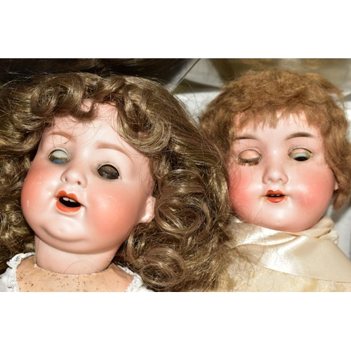 517 - AN ARMAND MARSEILLE BISQUE HEAD DOLL, imprinted number 390, having opening and closing eyes, teeth, ... 