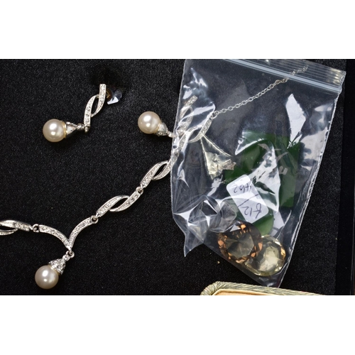 54 - A SELECTION OF COSTUME JEWELLERY, to include a colourless paste necklace and earring set, together w... 