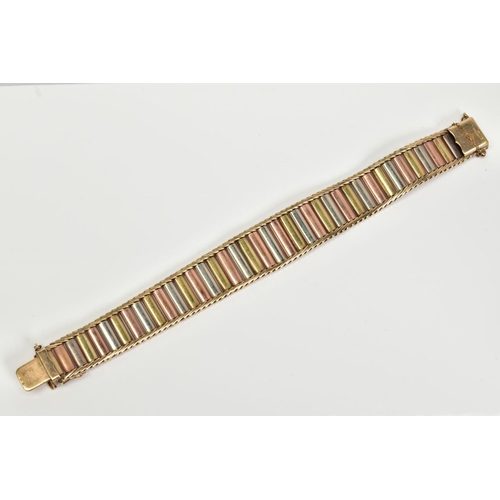 65 - A 9CT GOLD TRI COLOURED BRICK LINK AND HERRINGBONE DESIGN BRACELET, slightly tapered ends, approxima... 