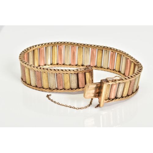 65 - A 9CT GOLD TRI COLOURED BRICK LINK AND HERRINGBONE DESIGN BRACELET, slightly tapered ends, approxima... 