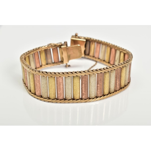 65 - A 9CT GOLD TRI COLOURED BRICK LINK AND HERRINGBONE DESIGN BRACELET, slightly tapered ends, approxima... 