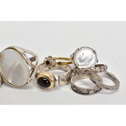 75 - A SELECTION OF RINGS, to include a cluster ring, designed with a central circular cut sapphire, a mo... 