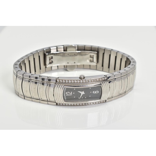 85 - A LADIES MAUBOUSSIN WRISTWATCH IN STAINLESS STEEL AND DIAMOND, oblong case measuring 32mm x 17.9mm, ... 