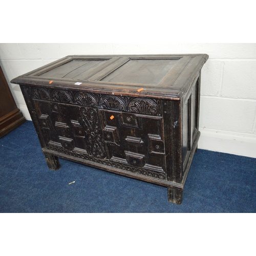 1363 - A 17TH CENTURY CARVED OAK JOINT COFFER, the hinged moulded cover above lunette carved frieze and dou... 