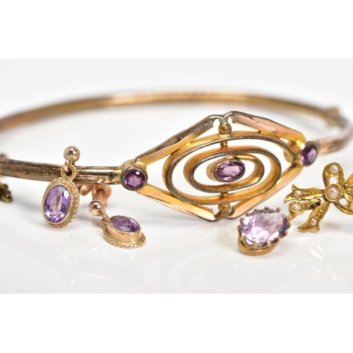 10 - AN AMETHYST COLLECTION OF JEWELLERY to include an early 20th Century amethyst gold plated oval hinge... 