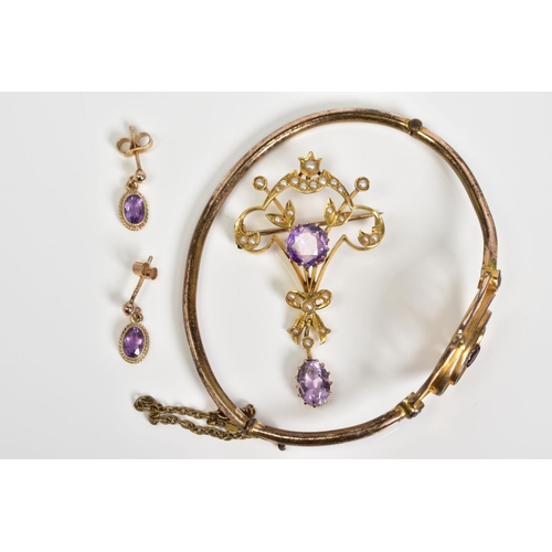 10 - AN AMETHYST COLLECTION OF JEWELLERY to include an early 20th Century amethyst gold plated oval hinge... 