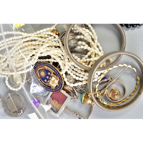 100 - A SELECTION OF ITEMS, to include various beaded necklaces, wristwatches, elasticated bangles, two th... 