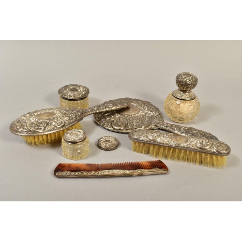 102 - A COLLECTION OF SILVER MOUNTED DRESSING TABLE ITEMS, comprising a four piece dressing table set in E... 