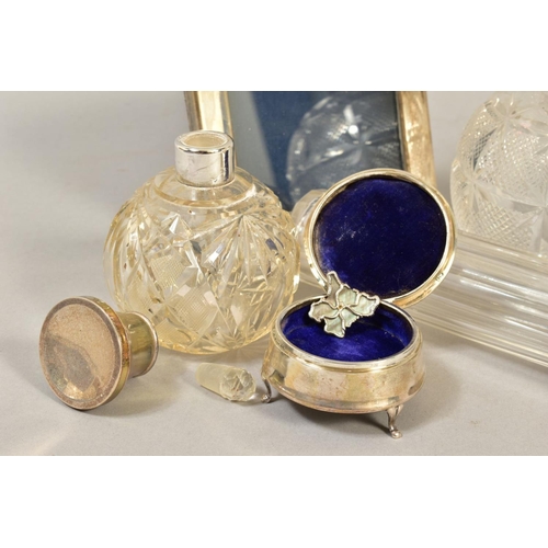 103 - A GROUP OF DRESSING TABLE SILVER, including two spherical cut glass scent bottles with silver pull o... 