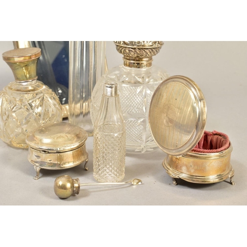 103 - A GROUP OF DRESSING TABLE SILVER, including two spherical cut glass scent bottles with silver pull o... 