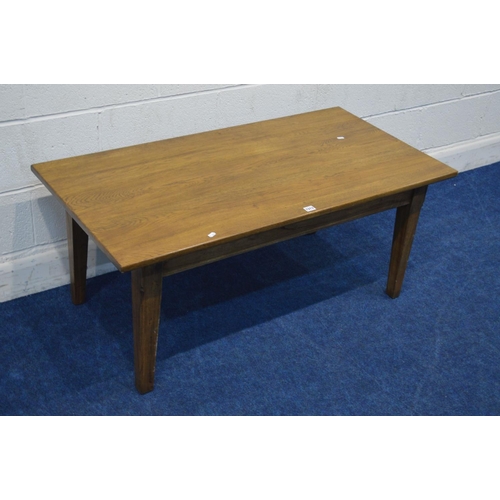 1313 - A MODERN GOLDEN OAK COFFEE TABLE, on square tapering legs, width 120cm x depth 61cm x height 51cm