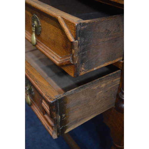 1314 - AN EARLY 20TH CENTURY OAK SIDE TABLE, four assorted geometric fronted drawers on barley twist legs u... 