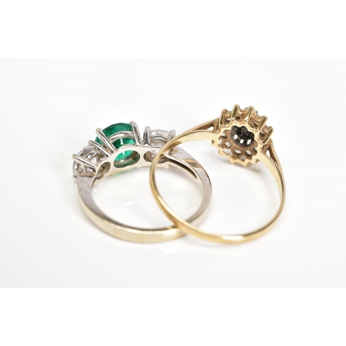 147 - TWO RINGS, the first a cluster ring set with an oval cut sapphire and colourless circular cut gemsto... 