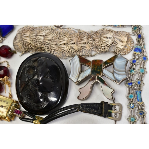 15 - A MISCELLANEOUS JEWELLERY COLLECTION to include a carved cameo jet brooch depicting a lady in profil... 