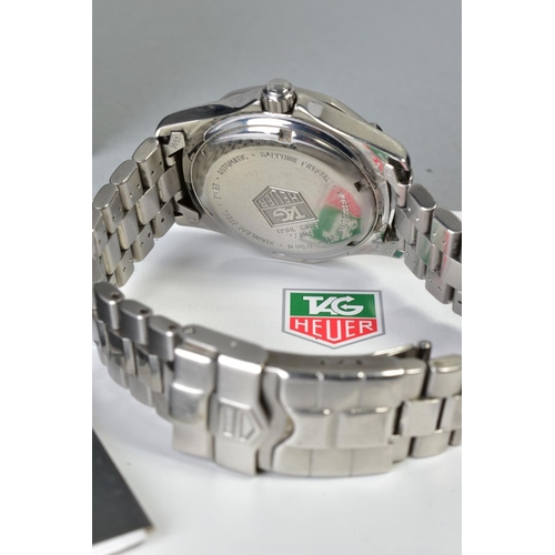 152 - A TAG HEUER 2000 SERIES AUTOMATIC WRISTWATCH, with a circular silver face and baton markers, date wi... 