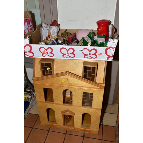 194 - A WOODEN DOLLS HOUSE, modelled as a three story Georgian town house, front opening to reveal six roo... 