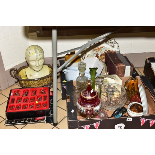 202 - TWO BOXES GLASSWARES, CERAMICS, BOOKS ETC, to include a Phrenology head, a boxed Continental chess s... 