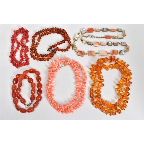 21 - A SELECTION OF NECKLACES, to include two modern amber bead necklaces, lengths 520mm - 670mm, a pink ... 