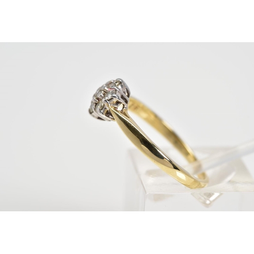 22 - A 9CT GOLD DIAMOND RING, designed as a cluster of round brilliant cut diamonds, to the tapered shoul... 