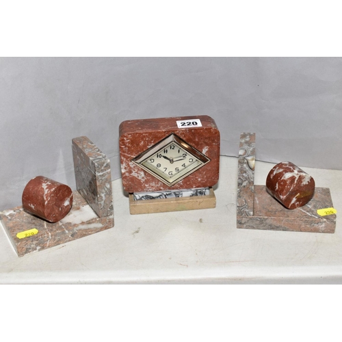 220 - A FRENCH ART DECO ROUGE AND VARIGATED MARBLE DESK CLOCK, with near matching marble book ends