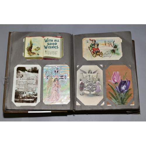 231 - A LARGE COLLECTION OF OVER FOUR HUNDRED AND SIXTY 'GREETINGS' TYPE POSTCARDS in a vintage album, the... 