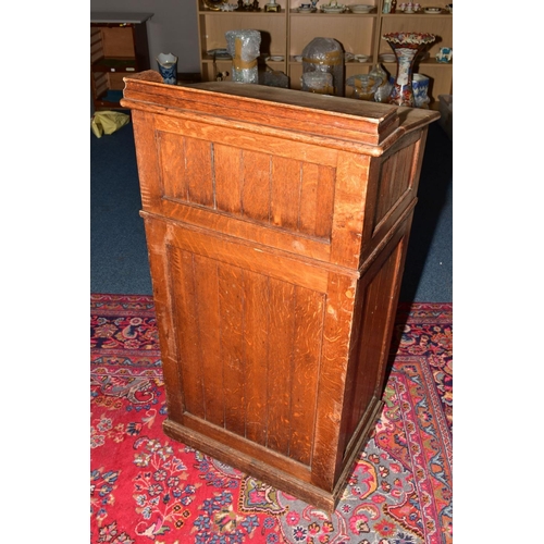 37 - A LATE 19TH CENTURY OAK LECTURN, raised back, sloped top, tongue and groove panelled sides, single s... 